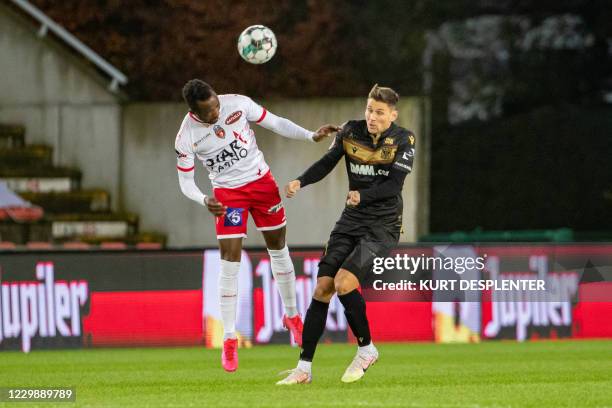 Mouscron's Fabrice Olinga and STVV's Oleksandr Filippov fight for the ball during a soccer match between Royal Excel Mouscron and Sint-Truiden VV,...