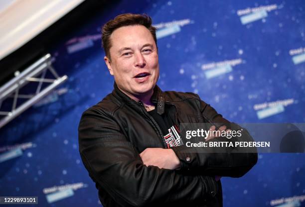 SpaceX owner and Tesla CEO Elon Musk poses as he arrives on the red carpet for the Axel Springer Awards ceremony, in Berlin, on December 1, 2020.