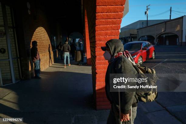 People walk into downtown after crossing the United States-Mexico border on December 1, 2020 in Calexico, California. President-elect Joe Biden wants...