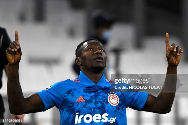 Olympiakos' Guinean midfielder Mohamed Mady Camara celebrates after scoring his team's first goal during the UEFA Champions League Group C football...