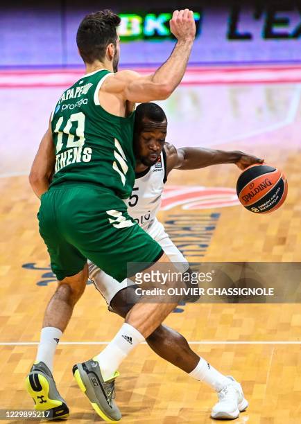 S French player Charles Kahudi fights for the ball with Panathinaikos' Greek player Ioannis Papapetrou during of the Euroleague basket-ball match...