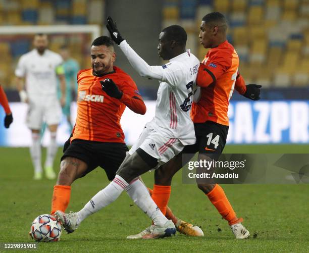 Ferland Mendy of Real Madrid in action against Dentinho and Tete of Shakhtar during the UEFA Champions League group B football match between Real...