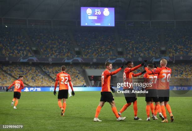 Players of Shakhtar celebrate after scoring a goal during the UEFA Champions League group B football match between Real Madrid and Shakhtar at...