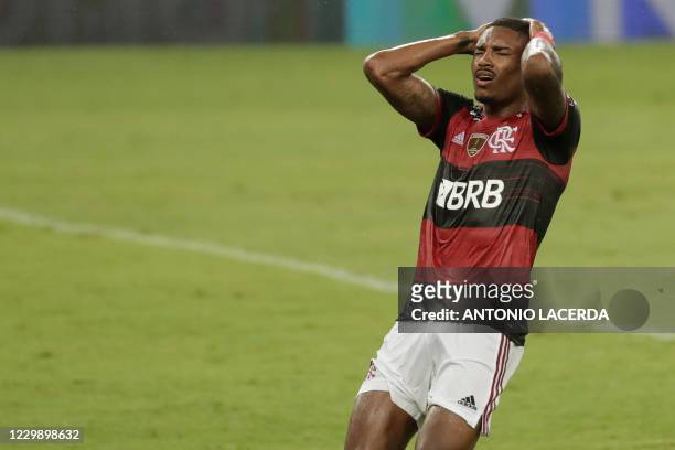 Brazil's Flamengo Vitinho reacts during the closed-door Copa Libertadores round before the quarterfinals football match against Argentina's Racing...