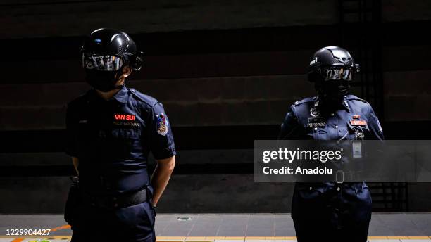 Officers of Keretapi Tanah Melayu Berhad wear a special helmet that able to scan the temperature of civilians at KL Sentral, Kuala Lumpur, Malaysia...