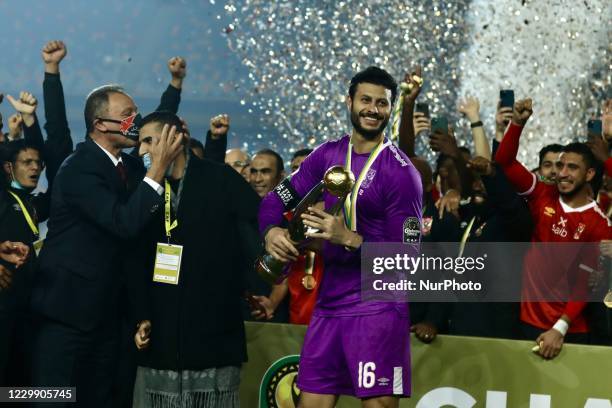 Players of Al Ahly celebrate with the trophy of CAF Champions League after winning the final match between Zamalek and Al Ahly at Cairo stadium on 27...