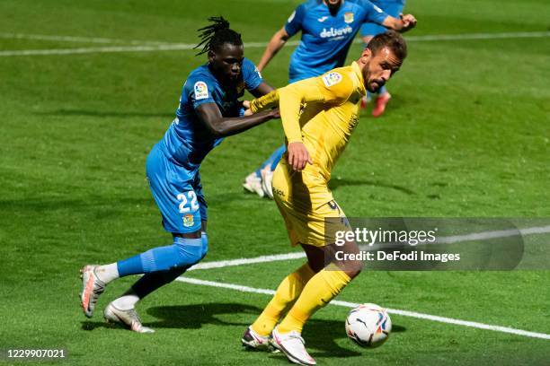 Pathe Ciss of CF Fuenlabrada and Orlando Carlos Braga de Sa of Malaga CF battle for the ball during the La Liga SmartBank match between Fuenlabrada...