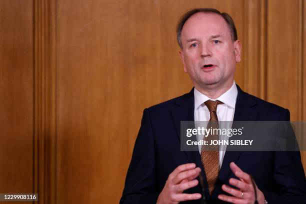 Chief Executive of the National Health Service Simon Stevens speaks during a virtual press conference inside 10 Downing Street in central London on...