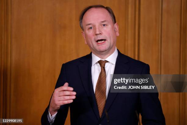 Chief Executive of the National Health Service Simon Stevens speaks during a virtual press conference inside 10 Downing Street in central London on...