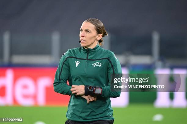 French referee Stephanie Frappart looks on as she warms up on the pitch prior to the UEFA Champions League Group G football match Juventus vs Dynamo...