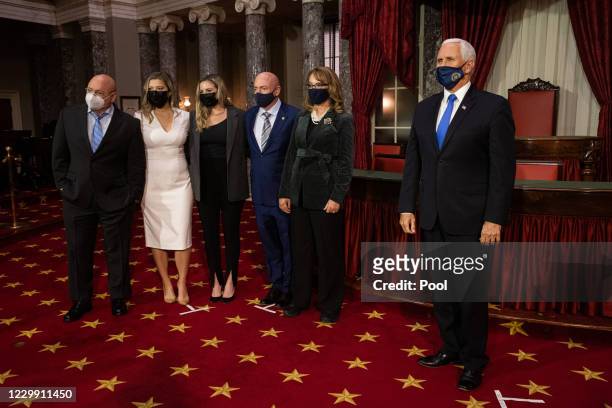 From right: Vice President Mike Pence , former U.S. Rep. Gabby Giffords, Sen. Mark Kelly , Mark Kelly's daughters Claudia Kelly and Claire Kelly, and...