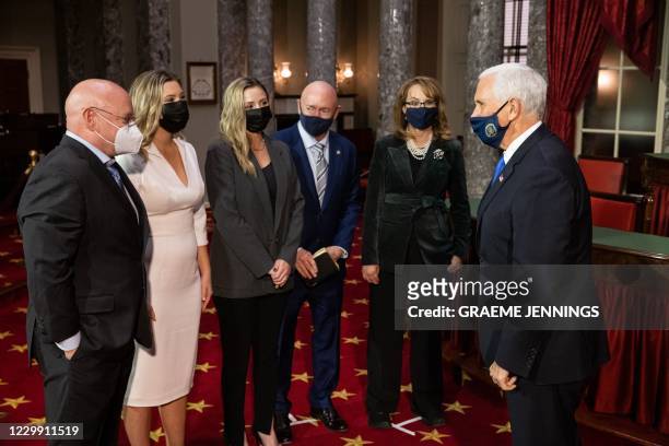 Vice President Mike Pence, Former Congresswoman Gabby Giffords, Senator Mark Kelly, Mark Kelly's daughters Claudia Kelly and Claire Kelly, and...