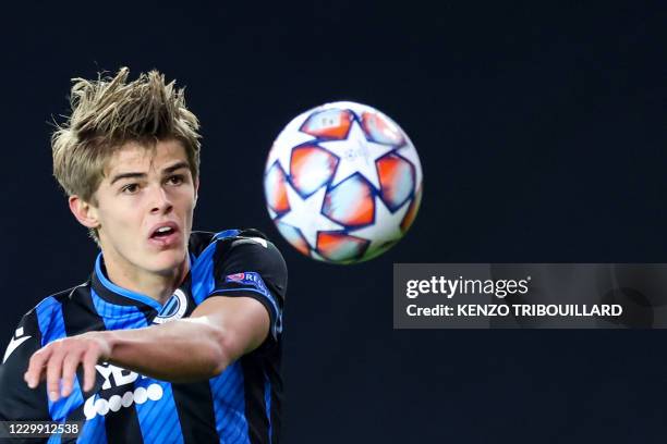 Club Brugge's Belgian midfielder Charles De Ketelaere eyes the ball during the UEFA Champions League Group F football match between Club Brugge and...
