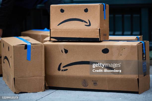 Cardboard boxes made to resemble Amazon.com Inc. Packages during a protest outside the home of Amazon Chief Executive Officer Jeff Bezos in New York,...