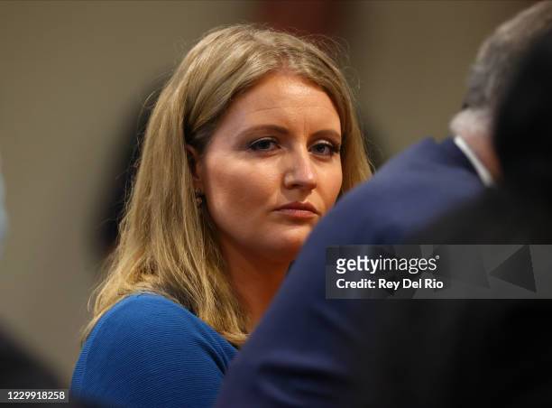 Jenna Ellis, a member of U.S. President Donald Trump's legal team, listens to Detroit poll worker Jessi Jacobs during an appearance before the...