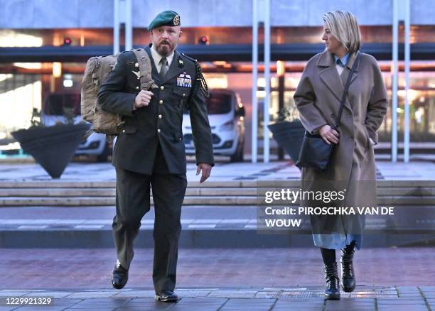 Marco Kroon and his wife arrive at the court in Arnhem, the Netherlands, on December 3, 2020. - The Dutch Commander, awarded of the highest military...