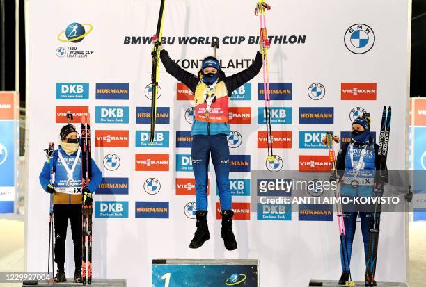 Second-placed Anais Chevalier-Bouchet of France, winner Hanna Öberg of Sweden and third-placed Elvira Öberg of Sweden celebrate on the podium after...