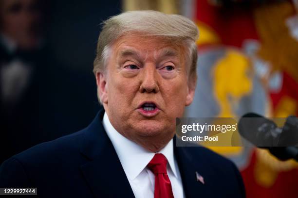 President Donald Trump speaks about the election after presenting the Medal of Freedom to former college football coach Lou Holtz in the Oval Office...