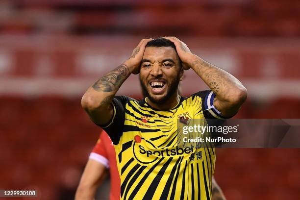 Troy Deeney of Watford reacts to a missed chance at goal during the Sky Bet Championship match between Nottingham Forest and Watford at the City...