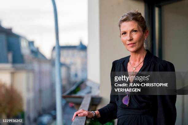 Melanie Witte, a pharmacist and nutritionist, who suffers from a cancer, poses at her home in Epinal, western France, on November 27, 2020. - Melanie...
