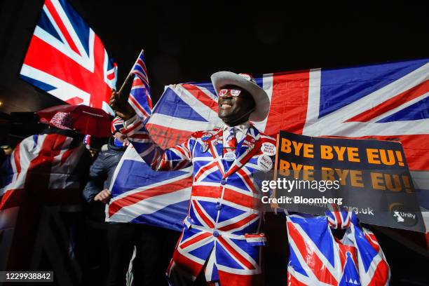 Reveler wears a Union flag, also known as a Union Jack, suit during the Leave Means Leave celebration at Parliament Square in London, U.K., on...