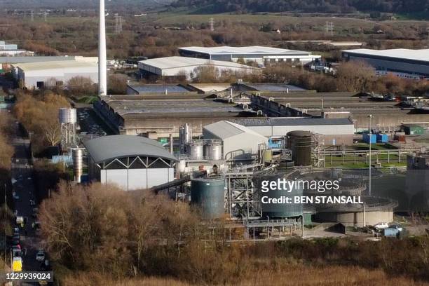 An aerial view shows a damaged silo at a waste water treatment plant in Avonmouth, near Bristol in south-west England on December 4, 2020 after an...