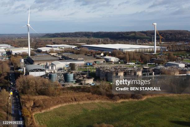 An aerial view shows a damaged silo at a waste water treatment plant in Avonmouth, near Bristol in south-west England on December 4, 2020 after an...