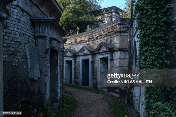 Tombs in the Circle of Lebanon are pictured in Highgate Cemetery on December 1, 2020 in north London. - Global warming is threatening London's...