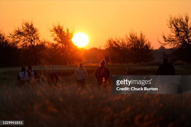 Golfers Megan Khang, Elizabeth Szokol and Jing Yan, of China, walk down the 10th fairway during the second round of the Volunteers of America Classic...