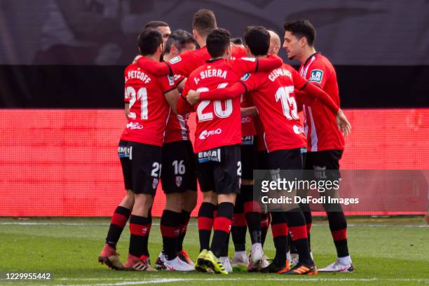 Mateusz Bogusz of UD Logrones celebrates after scoring his team's first goal with teammates during the La Liga SmartBank match between Rayo Vallecano...
