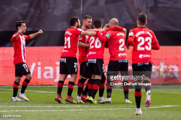 Mateusz Bogusz of UD Logrones celebrates after scoring his team's first goal with teammates during the La Liga SmartBank match between Rayo Vallecano...