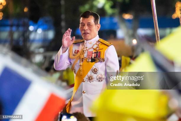 Thailand King Maha Vajiralongkorn waves to royalist supporters at Sanam Luang in front of the Grand Palace during a ceremony to mark the birthday of...