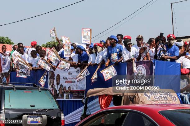 Supporters of Liberia's President George Weah gather during a campaign rally in Monrovia on December 05, 2020. - Voters in Liberia will head to the...