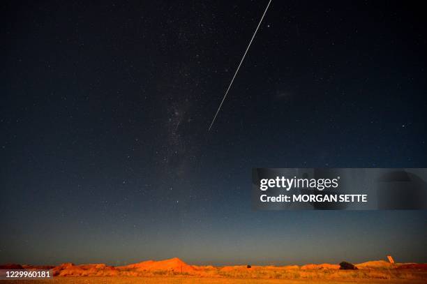 S Hayabusa-2 probe's sample drop to earth after landing on and gathering material from an asteroid some 300 million kilometres from Earth is seen...
