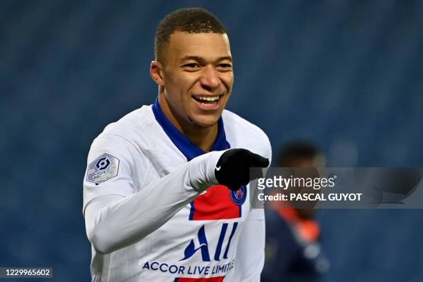 Paris Saint-Germain's French forward Kylian Mbappe celebrates after scoring a goal during the French L1 football match between Montpellier Herault...