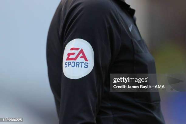 An EA Sports sponsor logo on the shirt sleeve of the Assistant Referee during the Sky Bet League One match between Shrewsbury Town and Charlton...