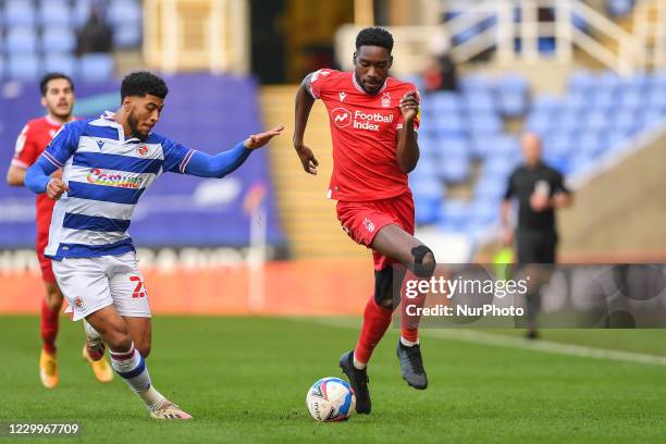 Sammy Ameobi of Nottingham Forest battles for the ball with Josh Laurent of Reading during the Sky Bet Championship match between Reading and...