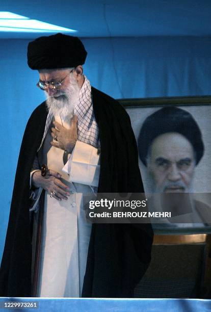 Iranian supreme leader Ayatollah Ali Khamenei attends a ceremony marking the 15th anniversary of the death of his predecessor Ayatollah Ruhollah...