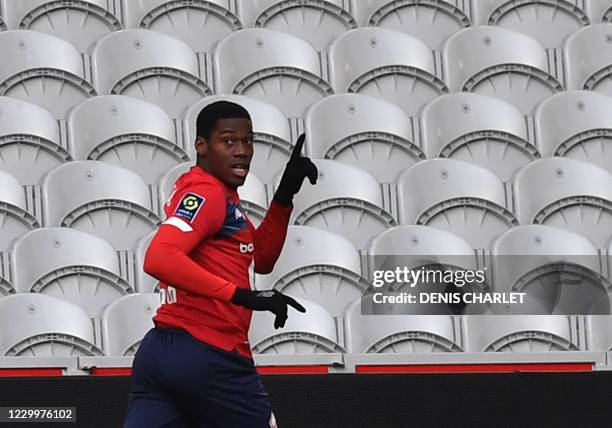 Lille's French forward Jonathan David celebrates after scoring a goal during the French L1 football match between Lille OSC and AS Monaco at the...