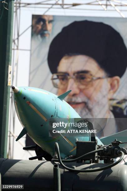 An Iranian Sayyad-1 surface-to-air missile is seen on display, 26 September 2007, in front of a large portrait of Iran's Supreme Leader Ayatollah Ali...