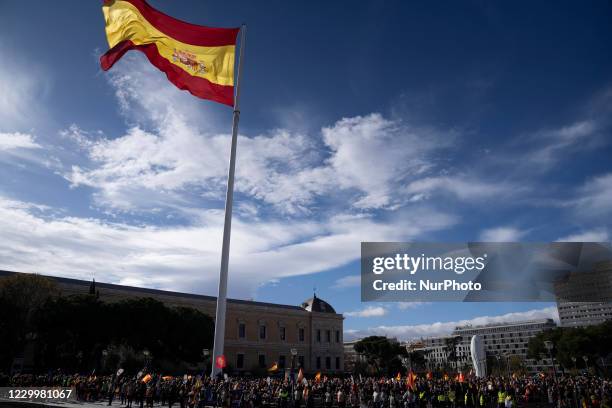 Demonstrators showing flags of Spain, march through the streets of downtown Madrid in support of the Constitution of 1978 of Spain, the day that the...