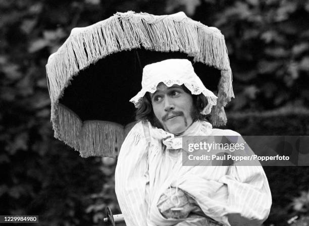 Barry Gibb of The Bee Gees dressed as a baby during the filming of "Cucumber Castle", a comedy film written and produced by The Bee Gees to accompany...