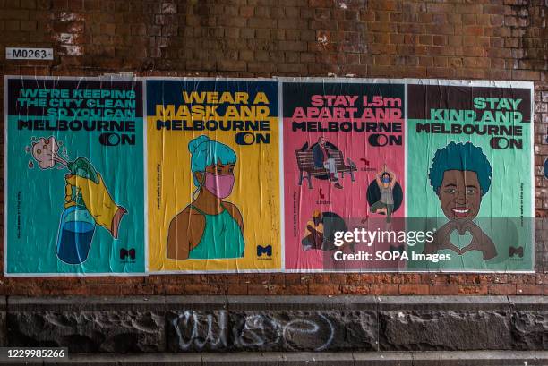 Measures" related art work posters seen a street wall in Melbourne CBD.