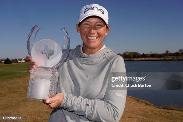 Angela Stanford poses with the trophy after winning the Volunteers of America Classic at the Old American Golf Club on December 6, 2020 in The...