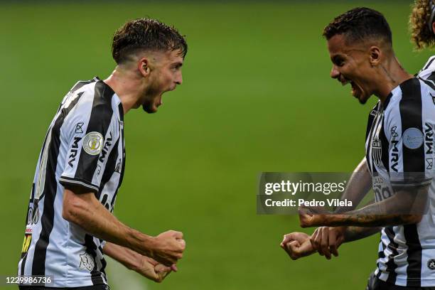 Hyoran of Atletico MG celebrates with Allan a scored goal against Internacional during a match between Atletico MG and Internacional as part of...