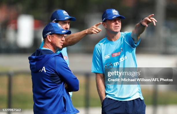 David Noble, Senior Coach of the Kangaroos, Jordan Russell and John Blakey are seen during the North Melbourne Kangaroos training session at Arden...