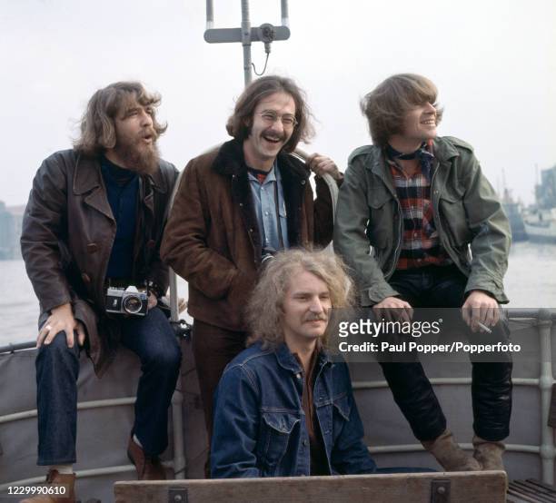 American rock band Creedence Clearwater Revival Doug Clifford, Stu Cook and John Fogerty, Tom Fogerty photographed during a boat trip on the River...