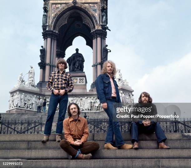 American rock band Creedence Clearwater Revival John Fogerty, Stu Cook, Tom Fogerty and Doug Clifford photographed in front of the Albert Memorial...