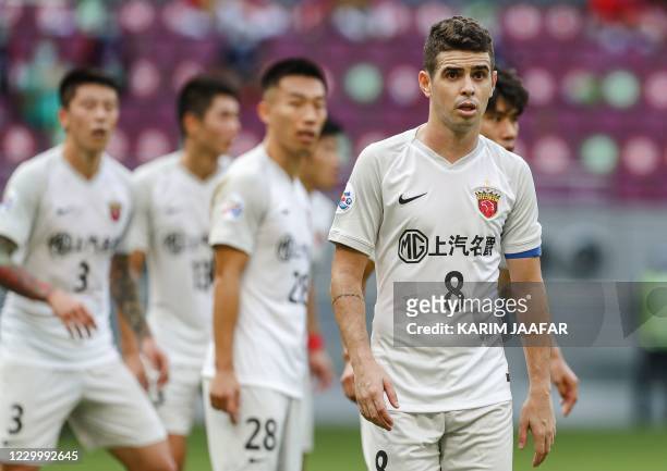 S midfielder and captain Oscar looks on during the AFC Champions League round of 16 football match between Japan's Vissel Kobe and China's Shanghai...