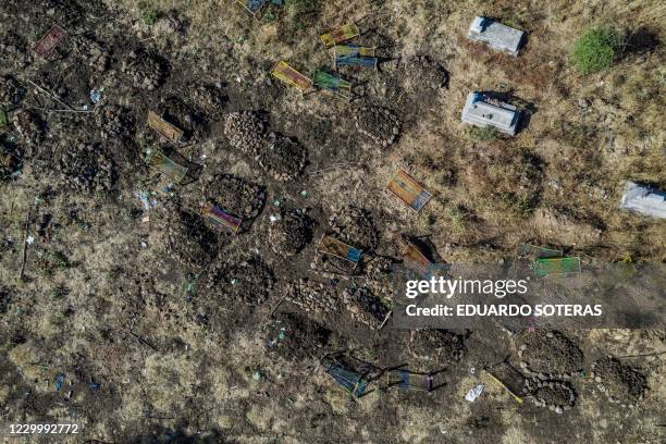 This file aerial view taken on November 21, 2020 shows a cemetery where alleged victims of the November 9, 2020 massacre were buried in collective...